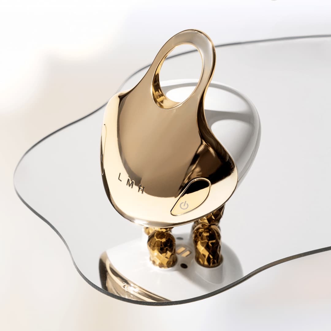 FourRolling: V-Face Lifting Skincare Device set on top of a mirror