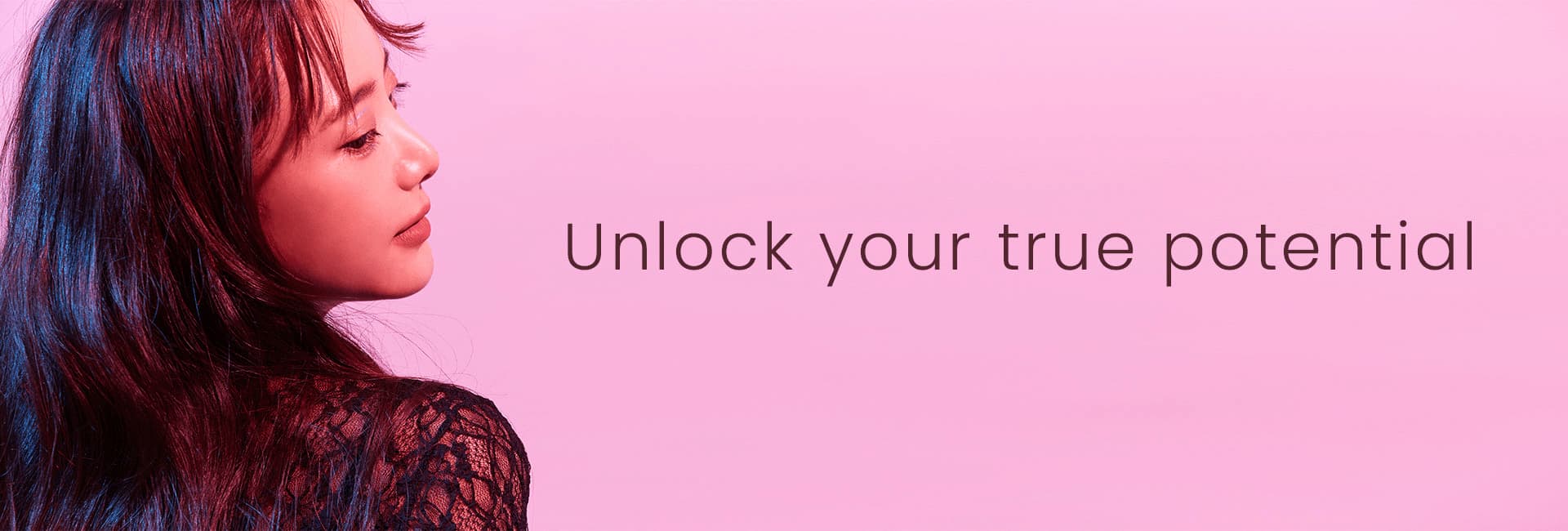 Model looking over her shoulder, with the text "Unlock your true potential" overlaid
